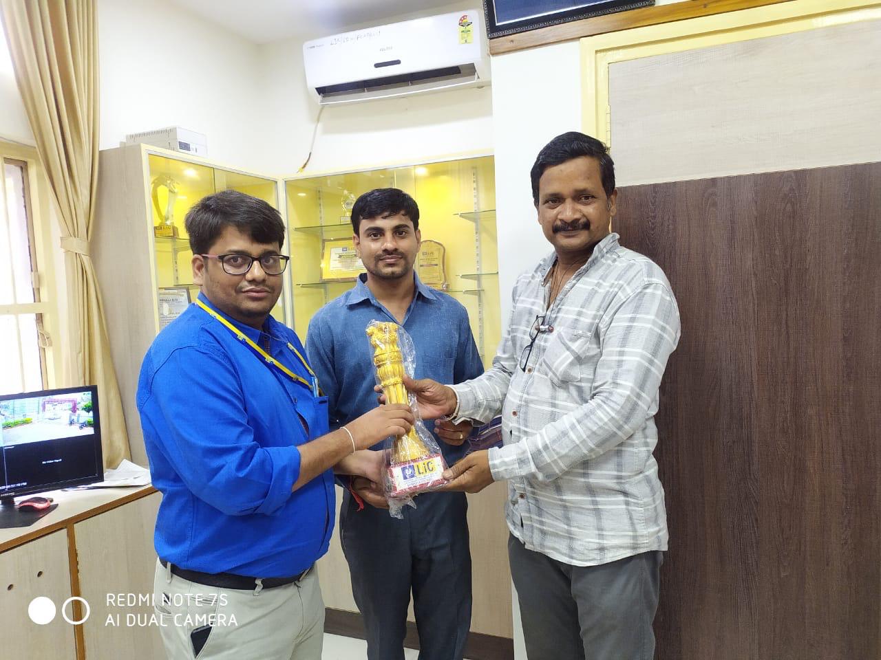 Awarded trophy for remarkable achievement